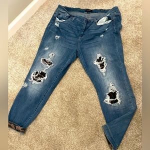 Distressed camo jeans